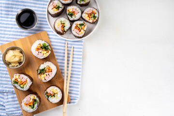 Traditional Korean food kimbap, with ham, vegetables and lettuce