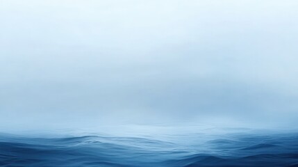 Fototapeta premium Misty Ocean Serenity: A Tranquil Seascape in Blue Hues
