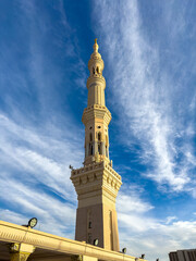 Fototapeta premium Upper Level of Al-Masjid an-Nabawi – Dome and Minarets at Sunrise