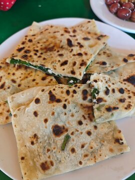 Turkish style Pastry called ''G&ouml;zleme'', Turkish food close up. Turkish homemade G&ouml;zleme with Cheese and Spinach.
