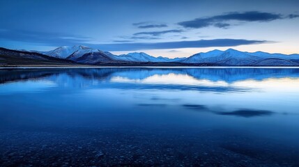 Obraz premium Tranquil sunset reflection over serene lake mountainous region nature photography calm environment wide angle view