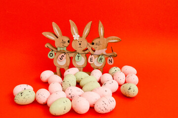 Easter Bunnies and Eggs on a Red Background