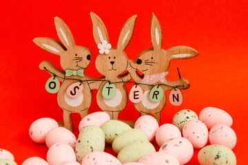 Easter Bunnies and Eggs on a Red Background