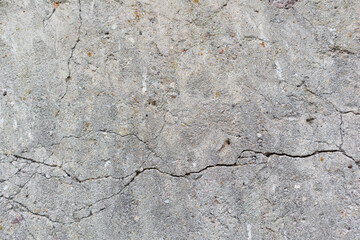 
Gray cracked concrete wall.