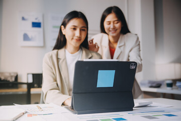 Group of Asian business people team meeting in modern office working design planning and ideas concept