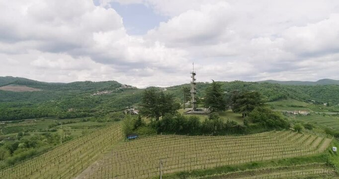 Aerial drone view pan of the Collio hills, Cormons, Nova Gorica near Gorizia. European Capital of Culture 2025. Typical local products vineyards and wines. Gonjače Tower places to visit and tradition.