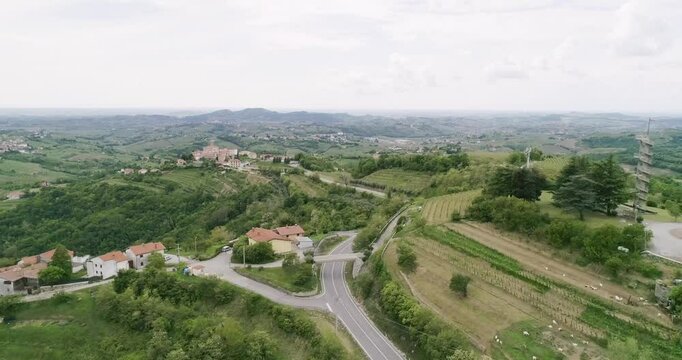 Aerial drone view pan of the Collio hills, Cormons, Nova Gorica near Gorizia. European Capital of Culture 2025. Typical local products vineyards and wines. Gonjače Tower places to visit and tradition.