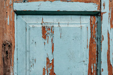 Old wooden door panel with cracked blue paint, brown wooden edges, wood texture, vintage, retro, natural material, background, texture design, worn look, door, decor, detail, interior, naturalness
