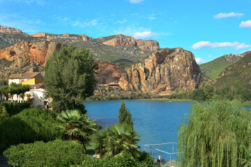Lake and mountains view in Sant Lloren&ccedil; de Montgai, Lleida, Spain. Sunny day, peaceful place, beautiful pond and rocky mountain landscape, special for hiking, trekking or climbing.