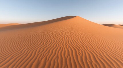 Endless sandy landscape showcases gentle dunes and intricate pat
