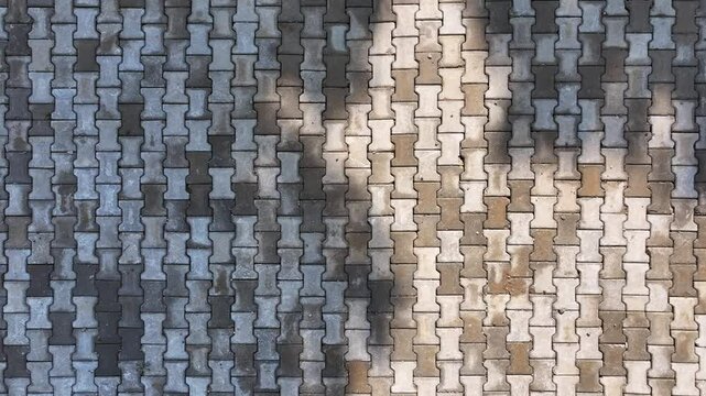 Top view of interlocking paving stone texture. Outdoor concrete slab pavement high quality drone image