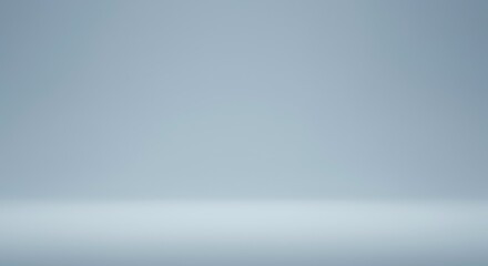 Obraz premium Elegant Blue Backdrop: An empty studio space bathed in soft, gradient blue light, providing a versatile background for product displays or artistic concepts.