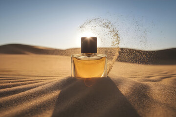 A rugged men’s cologne bottle mockup half-buried in golden desert sand with the sun setting behind it. Wind swirls sand around, highlighting the fragrance’s raw masculinity and adventure