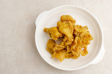 Fillet Ikan Telur Asin. Crispy fried fish fillet covered with salted egg sauce. Indonesian food
