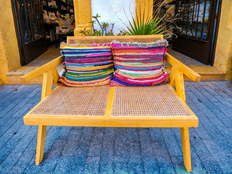 pillows cushions made of jarapas on a bench. traditional souvenir crafts