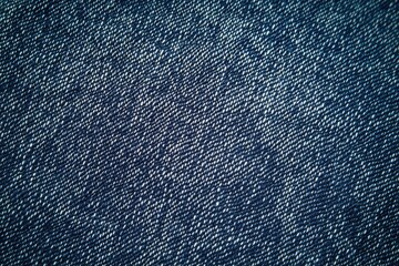 Naklejka premium Indigo blue denim fabric background, detailed texture of jeans material with a crosshatch pattern.