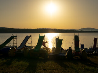 Water slides by the lakeshore at sunrise