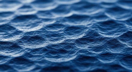 Obraz premium Ripples and Undulation: An abstract close-up reveals a textured, wave-like surface with a range of blue tones, creating a dynamic and tactile experience. 