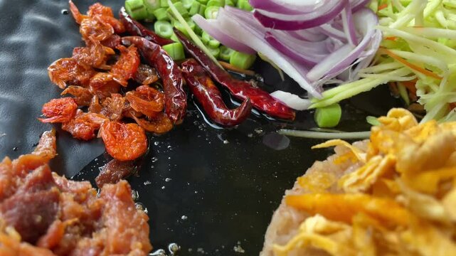 Popular of Asian food, Fried rich with shrimp paste served with mango and vegetables. Healthy food.
