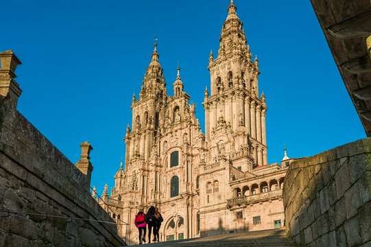 Santiago de Compostela Cathedral under a clear blue sky.