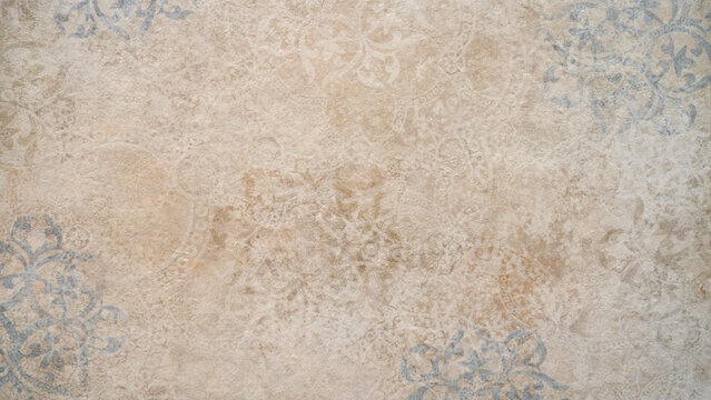 Old brown gray rusty vintage worn shabby patchwork motif tiles stone concrete cement wall texture background banner..