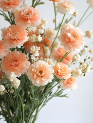 Obraz premium Soft Peach Flowers and White Blossoms in a Arranged Floral Bouquet