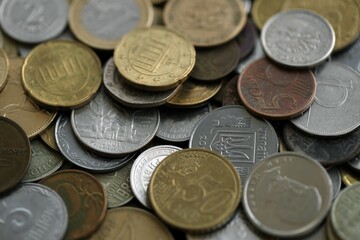 Big pile of different coins from various currencies and different countries around the world. Currency exchange