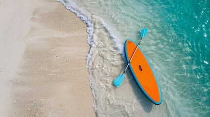A colorful paddleboard on the beach
