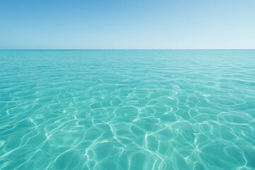 Crystal-clear turquoise water stretches endlessly under bright a