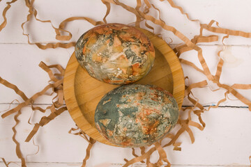 wooden plate with painted eggs
