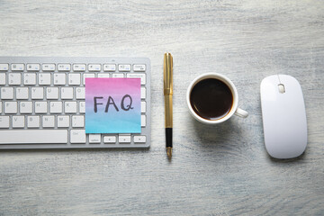 Faq message written on sticky note.