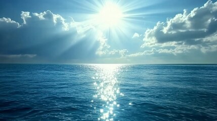 Obraz premium Radiant Sunlight Over Calm Ocean Water with Fluffy Clouds Above