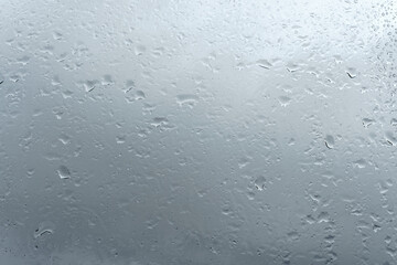 Raindrops on window glass. Rainy weather.