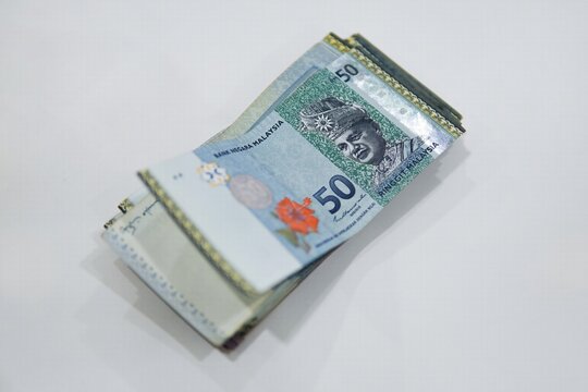 Malaysian ringgit money isolated on white background. currency of Malaysian ringgit banknotes background. Paper money. Financial concept.