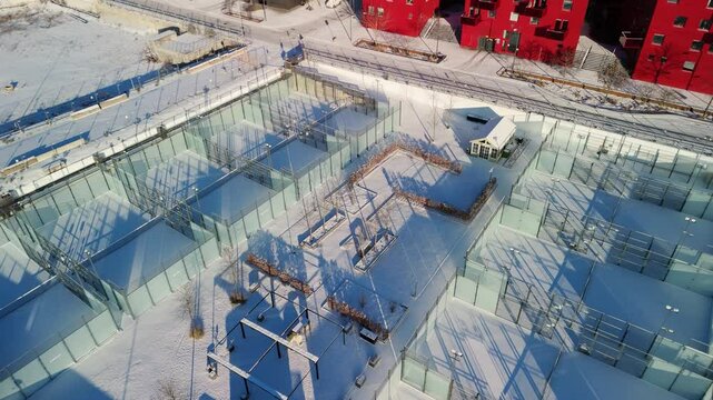 Closed padel tennis courts covered in snow.
