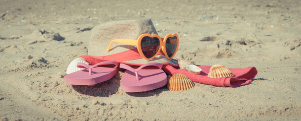 Different accessories using for relax on beach. Straw hat, flip flop, sunglasses and towel....