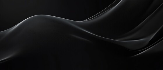 Fototapeta premium Black satin fabric draped elegantly on a smooth surface showcasing rich texture and luxurious appearance for fashion, design, or background use.