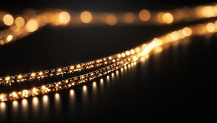 Fototapeta premium Glowing Gold Lights on Dark Background with Soft Focus Bokeh Effect Creating a Warm and Inviting Ambience Perfect for Celebrations and Events