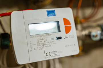 Smart water and heat meters with remote data transmission installed in a European utility system. The concept represents modern energy efficiency and digital infrastructure development