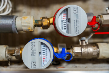 Smart water and heat meters with remote data transmission installed in a European utility system. The concept represents modern energy efficiency and digital infrastructure development