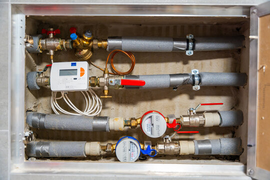Smart water and heat meters with remote data transmission installed in a European utility system. The concept represents modern energy efficiency and digital infrastructure development