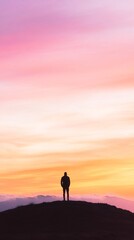 man hilltop pastel sunrise