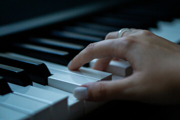 Obraz premium Piano keys person plays classical music black and white