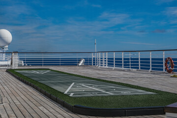 Shuffleboard board on outdoor deck of classic cruiseship cruise ship liner	