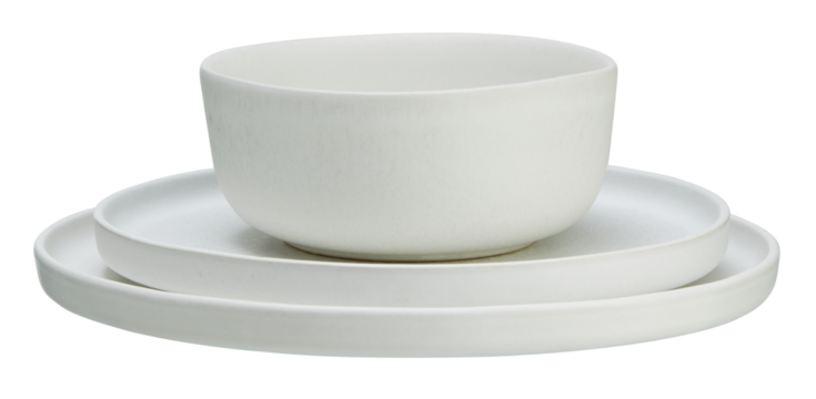 Stacked white ceramic plates and cups cut out isolated transparent background