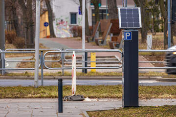 Parking meter for collecting parking fees in the center of an urban agglomeration, photovoltaic panel,