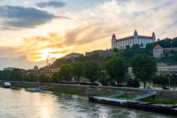 Obraz premium Sunset panorama of Bratislava Grad and downtown over Donau river, Slovakia capital city