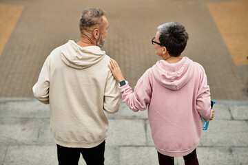 Mature couple enjoying a peaceful moment while walking together in a tranquil setting