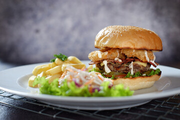 Still life of big tasty burger and french fries 03