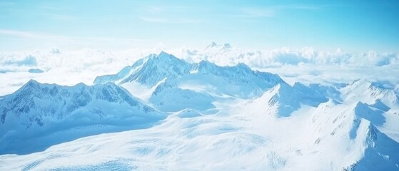 Fototapeta premium Snow-capped Mountain Peaks Soaring Above a Sea of Clouds